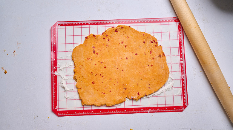 dough rolled flat onto a silicone mat