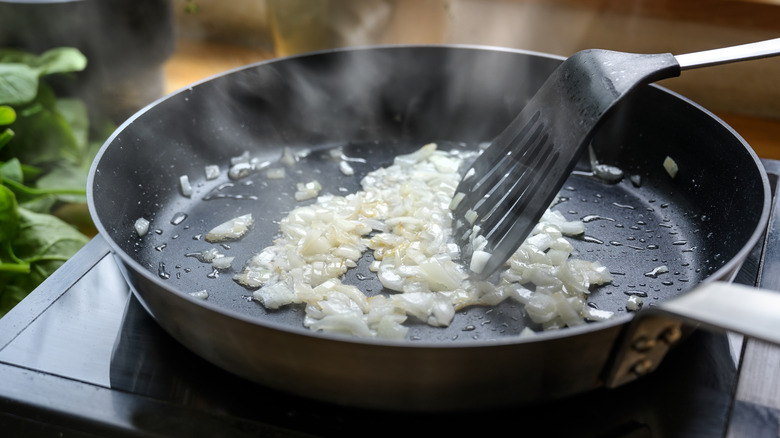 Pan of onions over heat