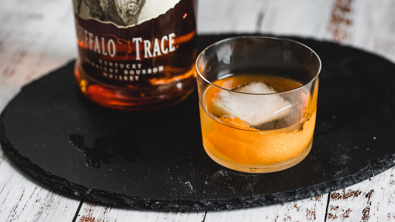 one cocktail glass and bottle