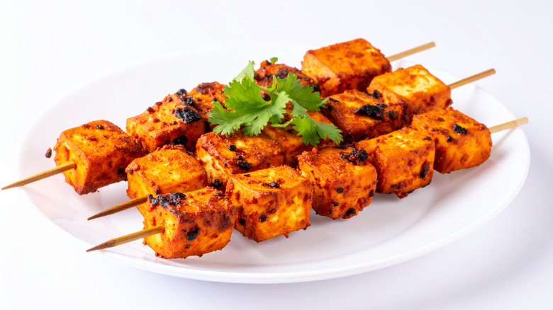 Vegetarian (non-vegan) paneer tikka on a white plate