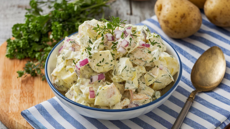 A bowl of potato salad on a table