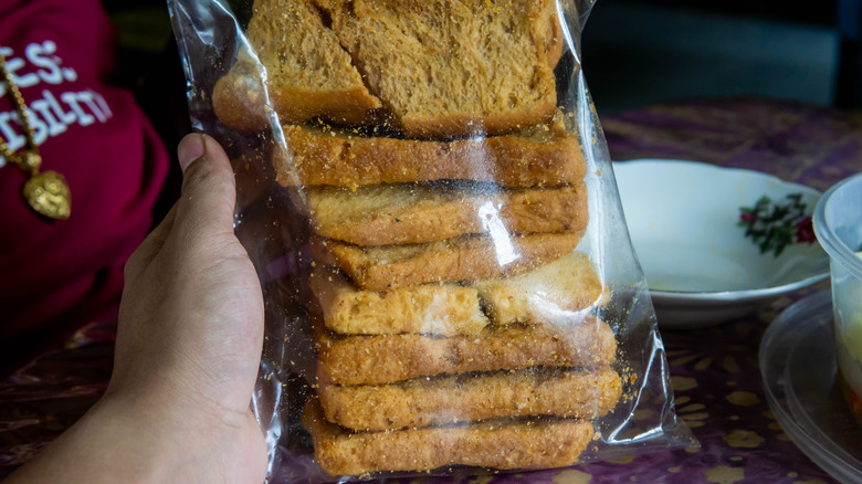 Slices of bread stacked and packaged in a clear plastic bag