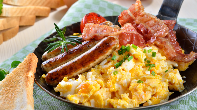 Scrambled eggs with bacon and sausage