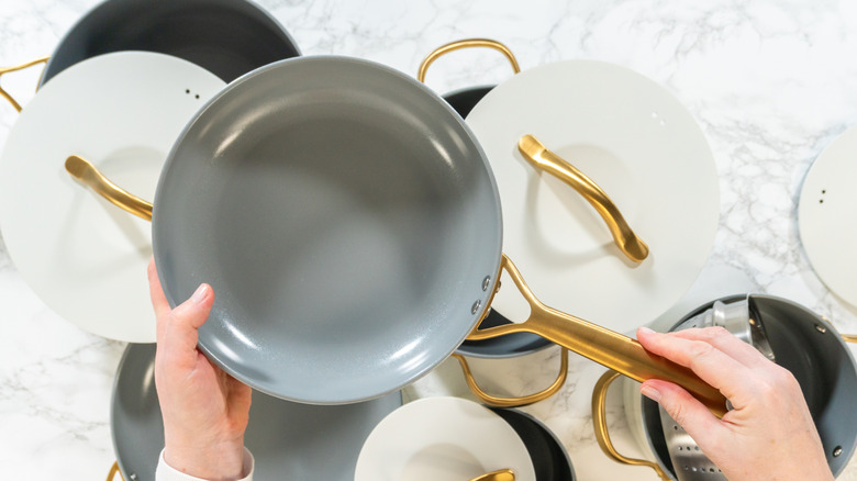 Woman holding ceramic pan