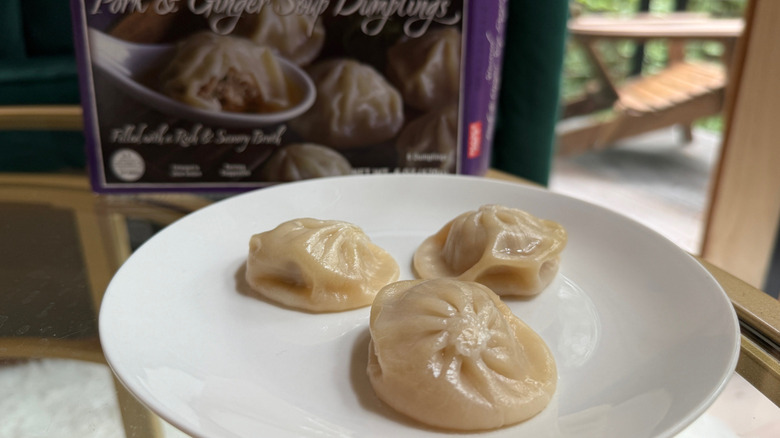 Trade Joe's soup dumplings on a plate with a box in background