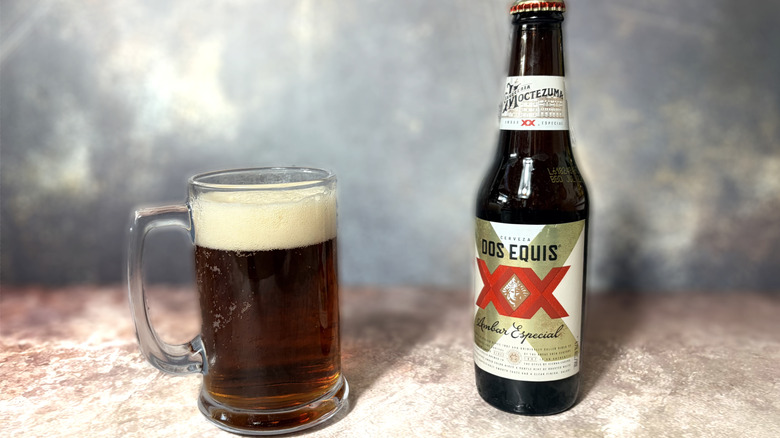 Bottle and glass of Dos Equis Ambar beer