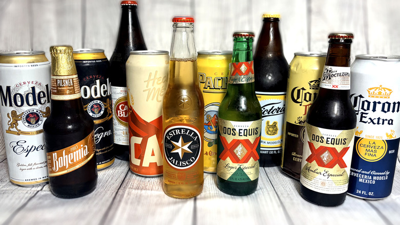 Selection of cans and bottles of Mexican beer arranged on a table