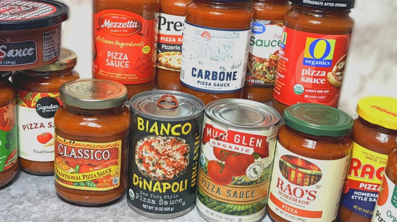 selection of jars and cans of pizza sauces