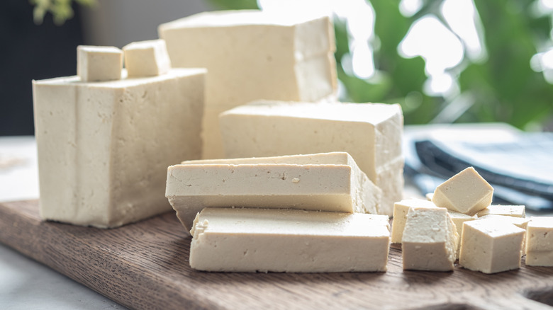 Tofu blocks on wood board