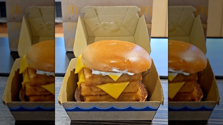 A triple Filet-o-FIsh from McDonald's in its box