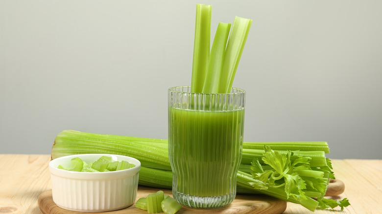 Celery juice with celery stalks garnish