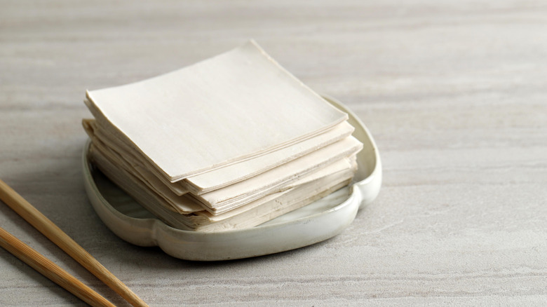stack of wonton wrappers on plate