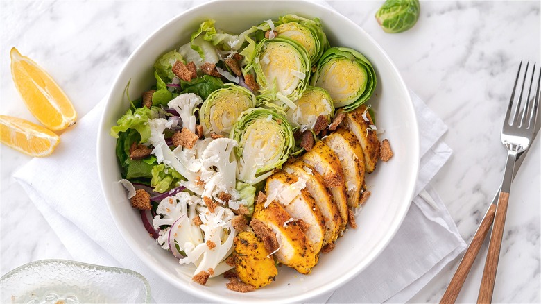 Brussels sprouts Caesar salad with chicken 