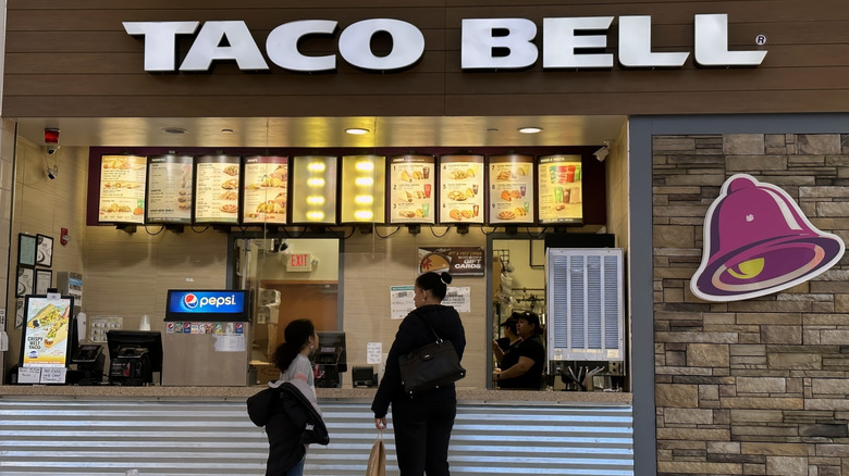 A Taco Bell counter, with customers waiting