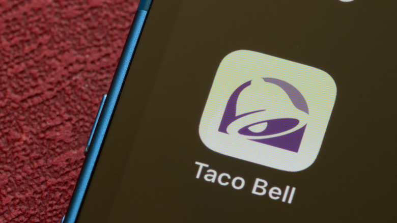 Taco Bell app icon on a phone screen