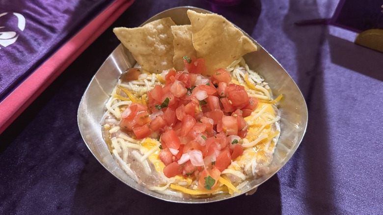 Taco Bell Chips & Nacho Supreme Dip with chips in a silver bowl