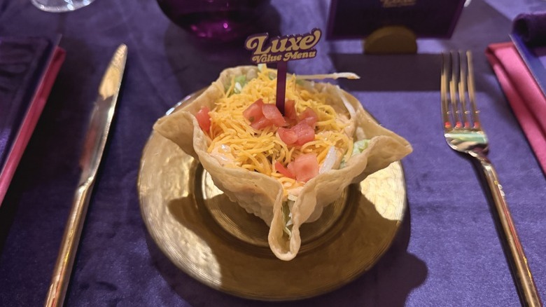 A Taco Bell Mini Taco Salad on a gold plate