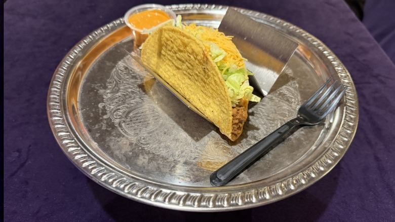 A Taco Bell Crunchy Volcano Taco on a silver platter