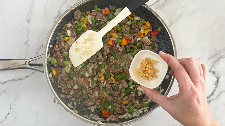 veggies and beef in skillet 