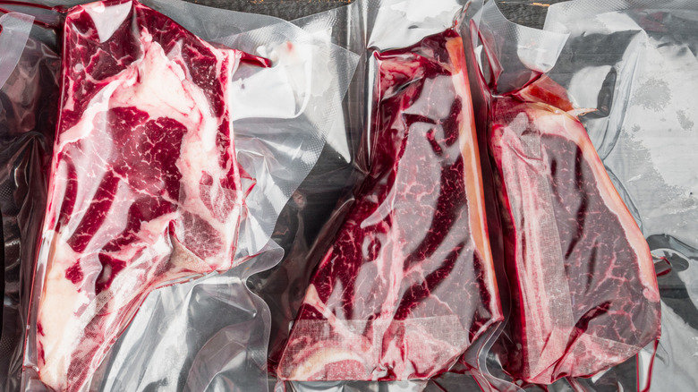 An assortment of vacuum-packed raw steaks