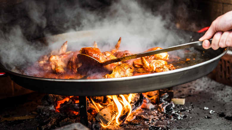 paella cooking over a fire