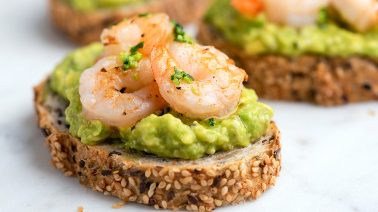 poached shrimp on avocado toast