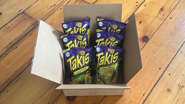 A cardboard box of new Takis flavor bags