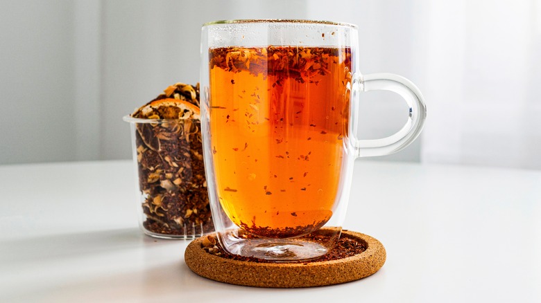 A clear cup of loose leaf tea