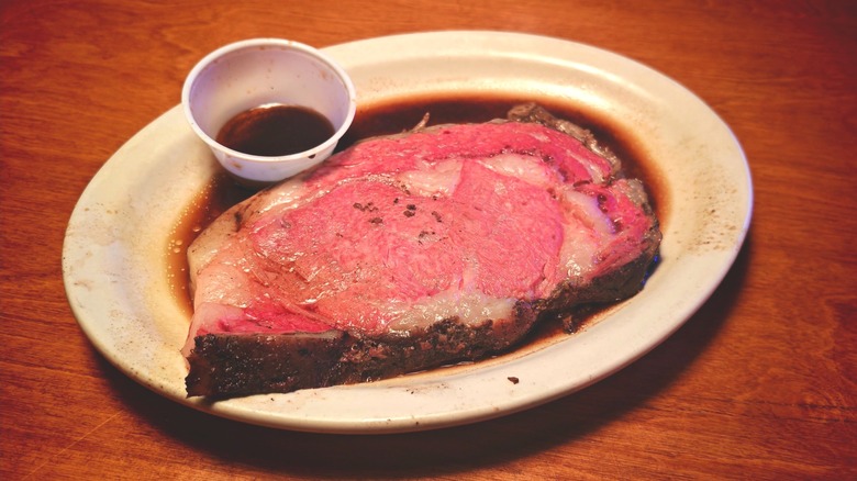 Prime rib on a plate au jus at Texas Roadhouse