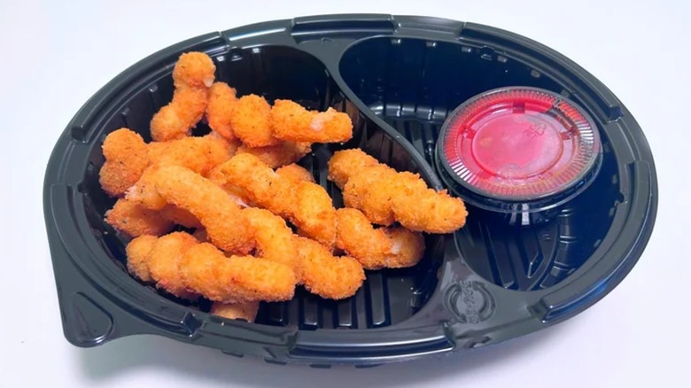 A black plastic tray of Cheesy Mozzarella Twists from Red Robin