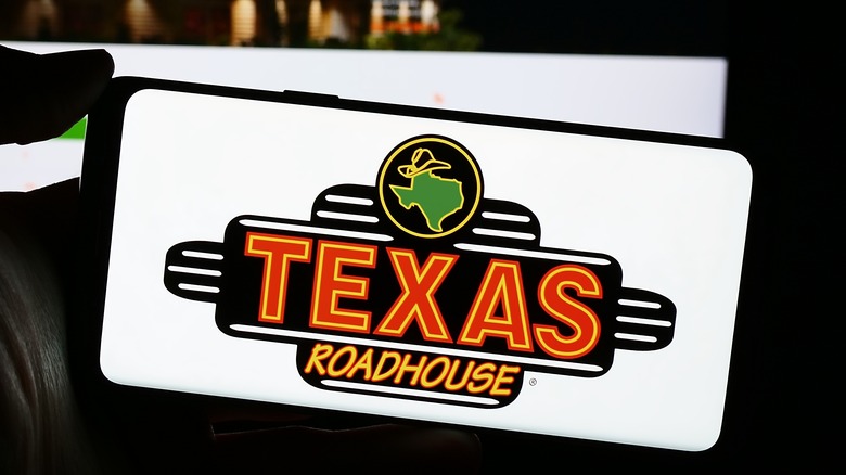 Texas Roadhouse logo on a phone