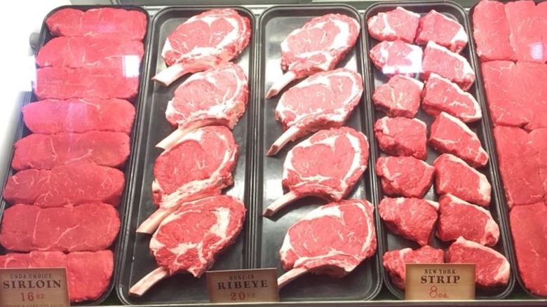 Texas Roadhouse steak case with raw steaks