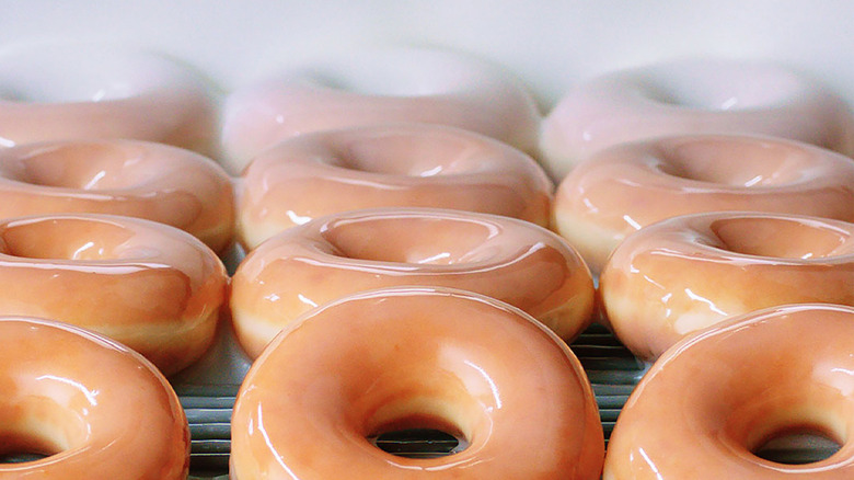 doughnuts being glazed