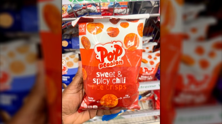 An orange bag of Pop Plosion Sweet & Spicy Chili Rice Crisps