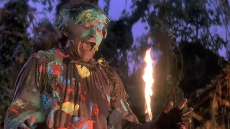 Peter Banning (Robin Williams) stands with multicolored food on his face, in a still from the film "Hook"