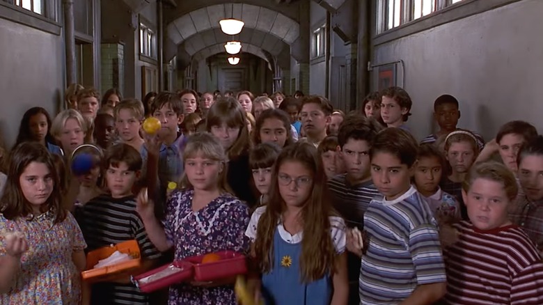 In a scene from "Matilda," a group of children are shown, ready to throw food at Miss Trunchbull