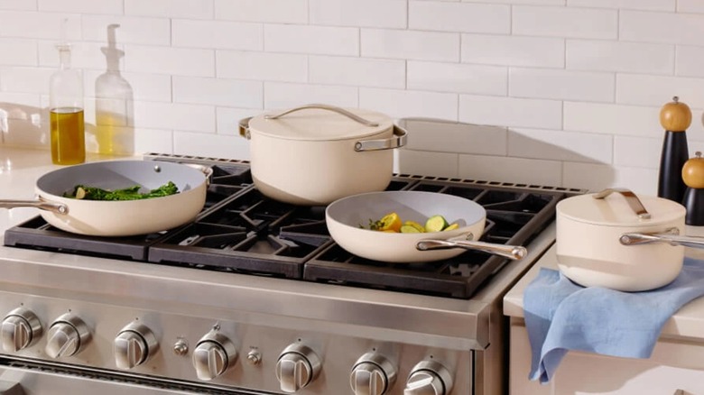 Caraway Home ceramic cookware set on stovetop