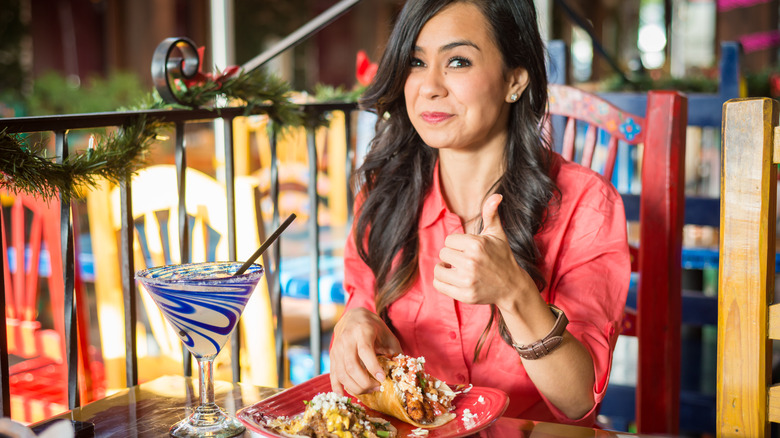 woman giving thumbs up