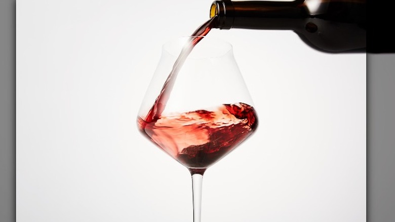 Bottle of rose being poured