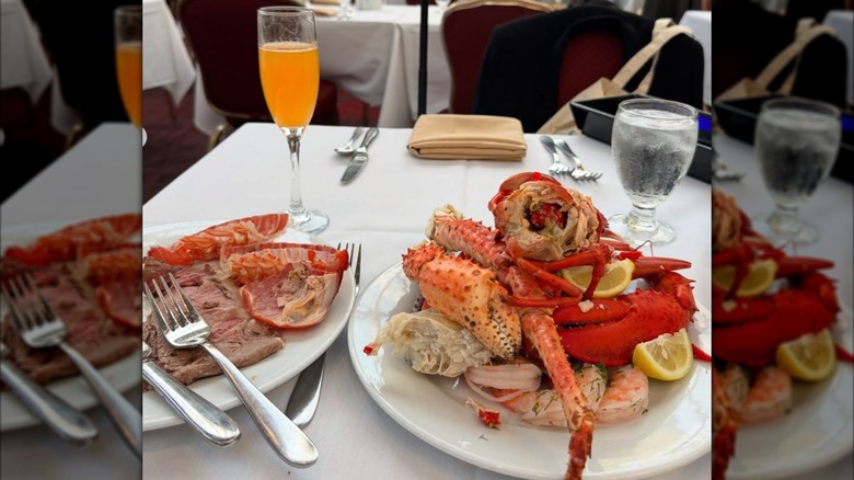 Two plates of food and a cocktail on a table at Cafe Sierra, Los Angeles