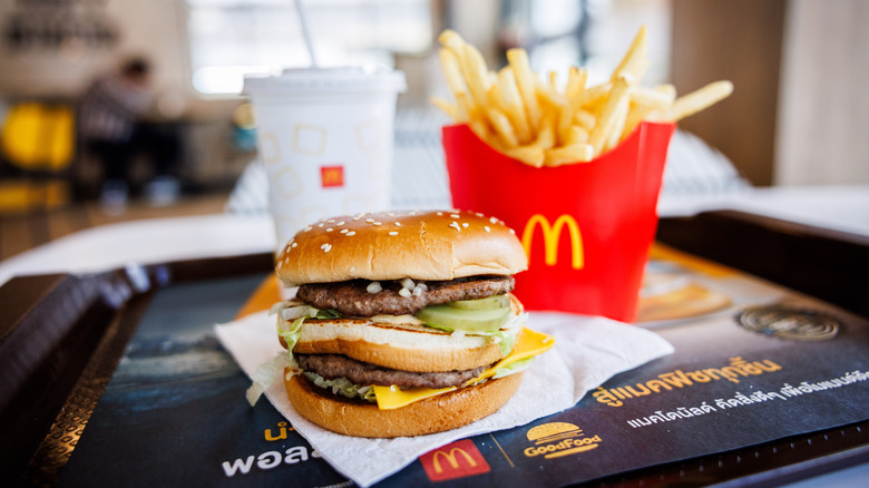 A Big Mac, side of fries, and drink on a tray at a McDonald's restaurant