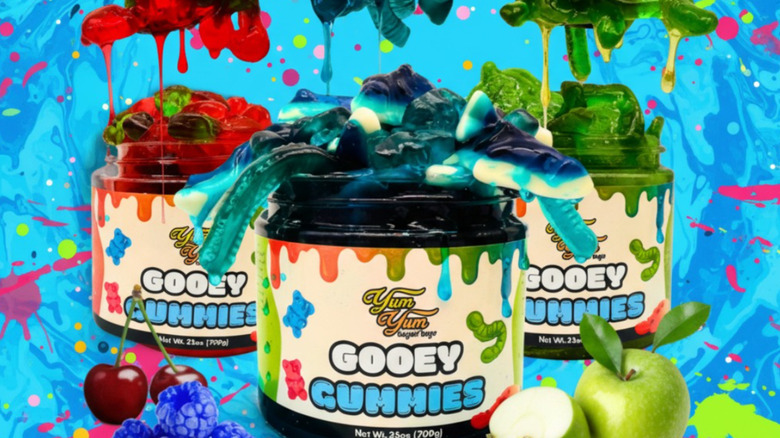 Jars of Yum Yum Gooey Gummies against a colorful background