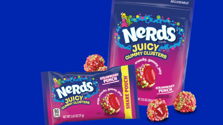 Nerds Juicy Gummy Clusters in pouches next to two loose pieces