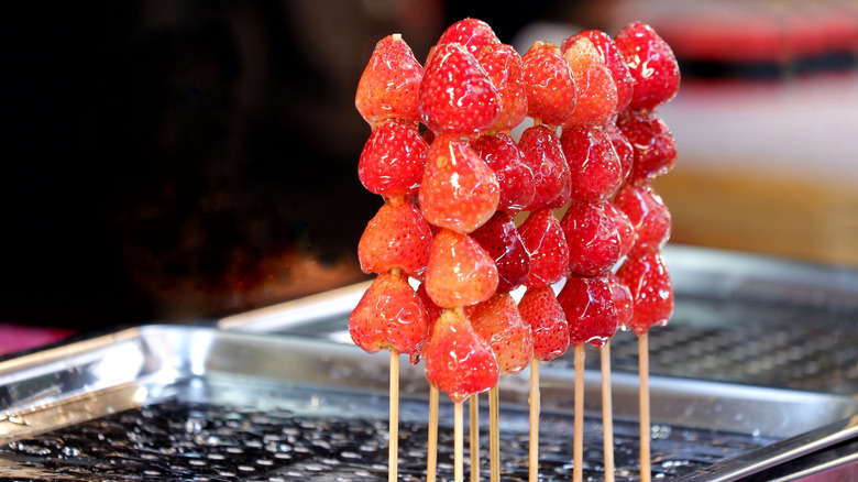 Tanghulu strawberries on skewers ready to be served