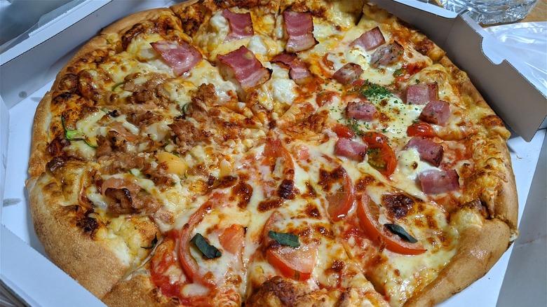 Takeout pizza with various toppings