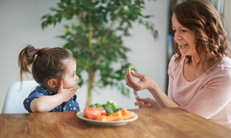 family eating broccoli