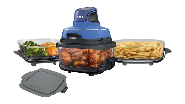 A Ninja Crispi glass air fryer with two other glass cooking chambers/storage containers