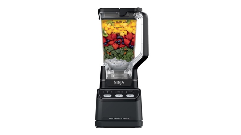 The Ninja Professional Blender full of fruit to be blended