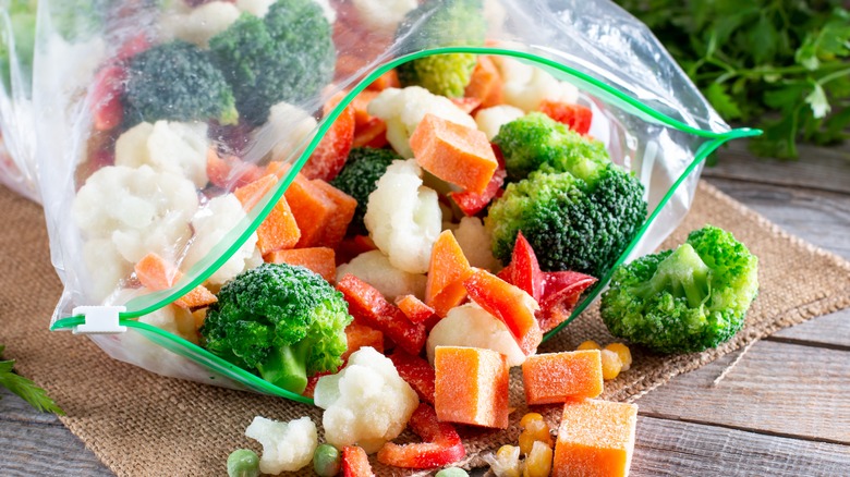 frozen vegetables on wooden table
