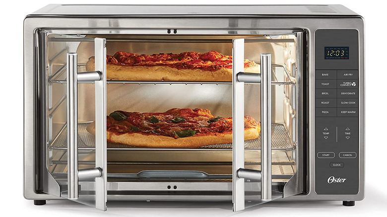 Oster XL 10-in-1 Countertop Toaster Oven with two pizzas
